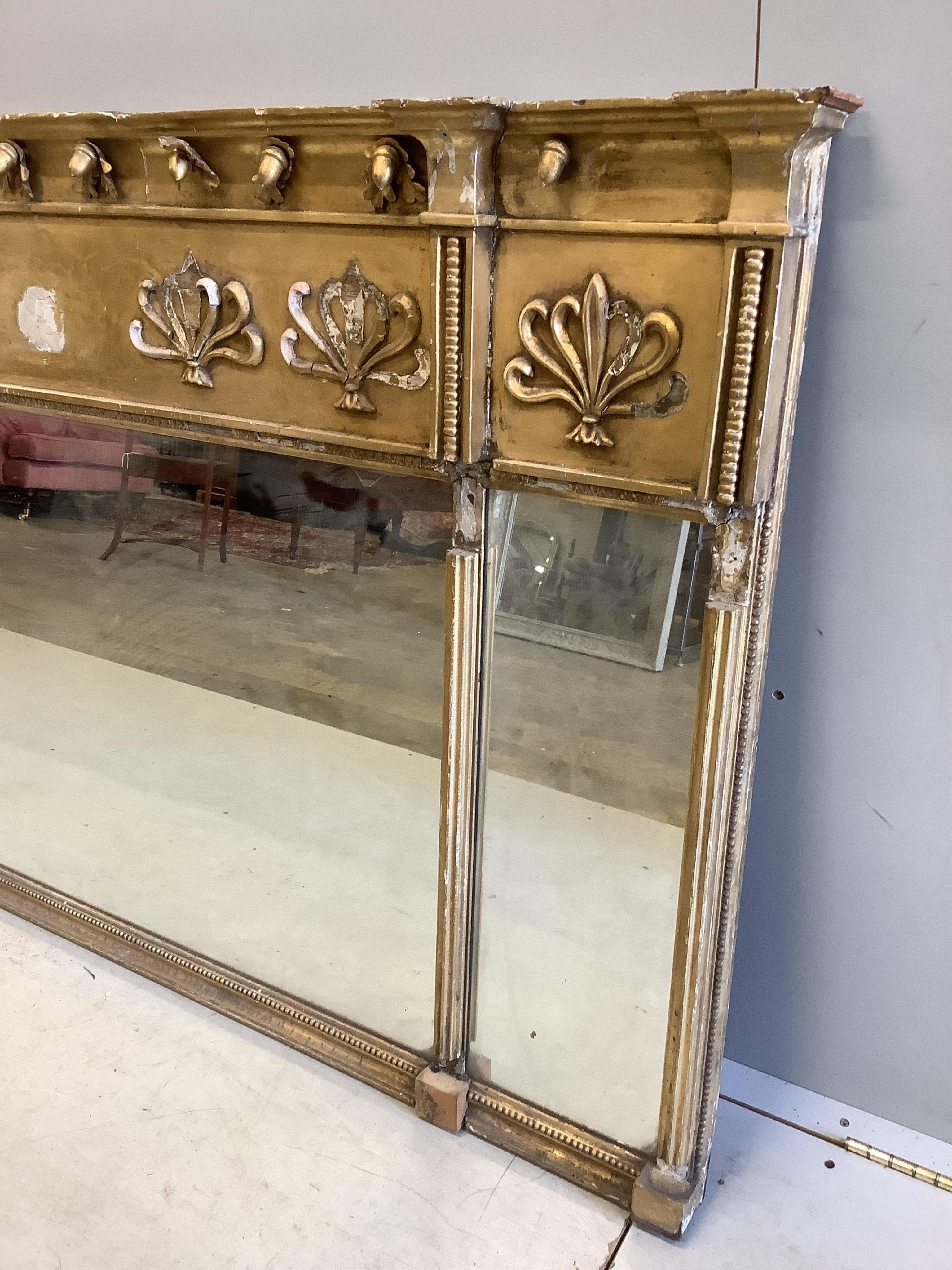 A Regency giltwood and composition triple plate overmantel mirror, width 161cm, height 94cm. Condition - poor, in need of restoration